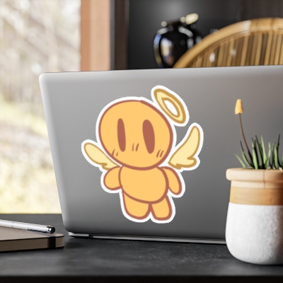 Cute orange angel character sticker on a laptop